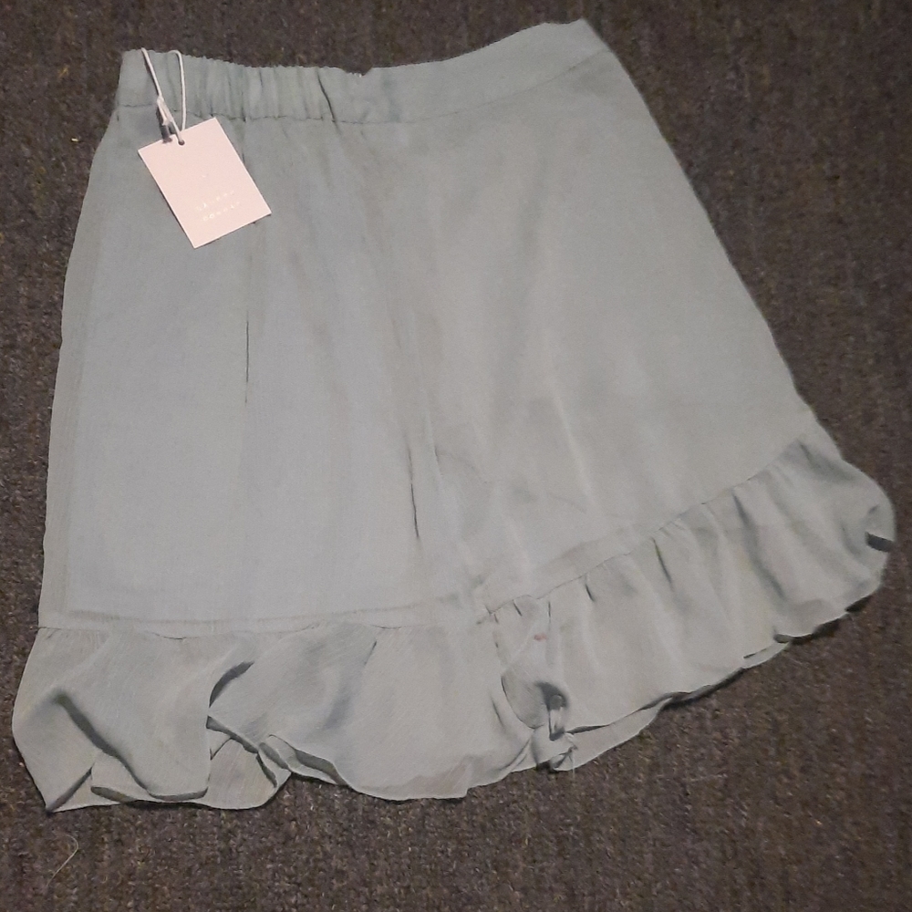 Pale teal skirt mid thigh length